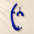 TibaToes foldable snorkel in Sky Blue, with its curved silicone tube, mouthpiece, mask keeper and matching storage cover.