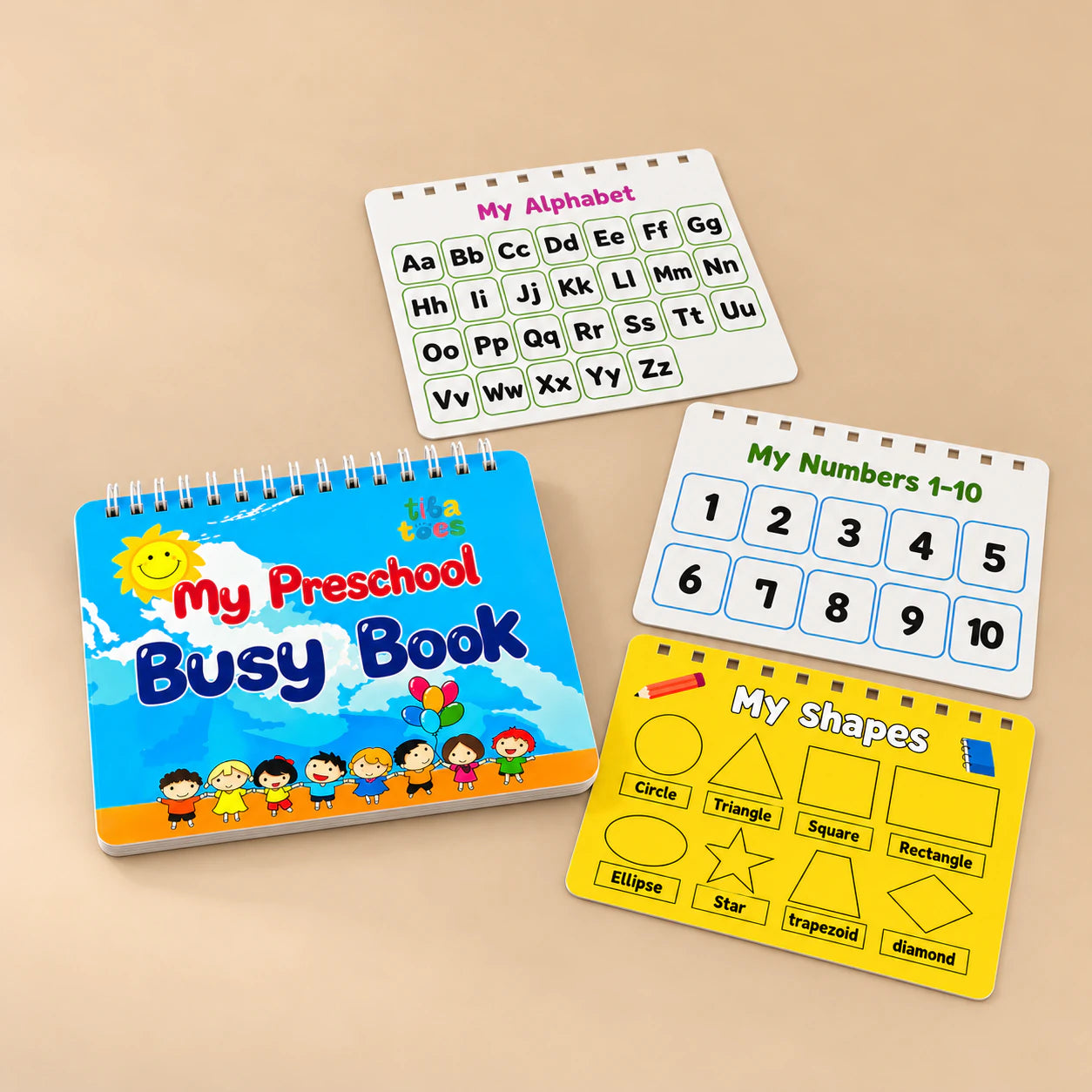 Blue TibaToes Preschool Busy Book with alphabet, numbers and shapes page previews arranged on a warm beige studio surface