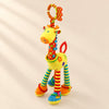 Yellow giraffe rattle with patterned red neck, striped legs, coloured rings and an orange and lime hanging loop.