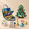 TibaToes™ Christmas Wonder Learning Bundle with Dinosaur Blue products arranged on a warm beige studio surface.