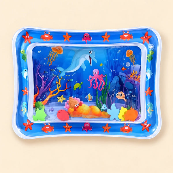 Blue ocean tummy time mat with a transparent water-filled centre and colourful floating shapes on beige.