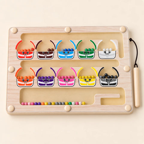 Wooden magnetic sorting board with ten colourful monster cups, beads and an attached wooden stylus on warm beige.