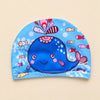 Blue whale fabric swim cap with small colourful fish and a stitched lower hem.