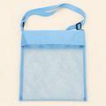 Blue Cloud Plush mesh beach bag shown empty, with matching adjustable shoulder strap and black slider on smooth pale warm beige.