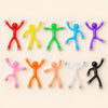 Ten colourful bendable magnetic figures arranged in two rows on warm beige.