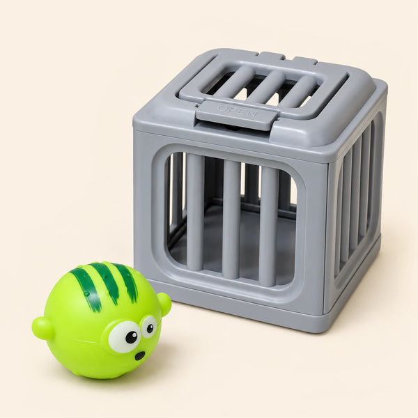 One lime-green striped puffer toy beside one gray rescue cage on a warm beige background. This is one separate variant choice.
