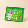 Hands holding the green My Body quiet book, showing its illustrated cover.