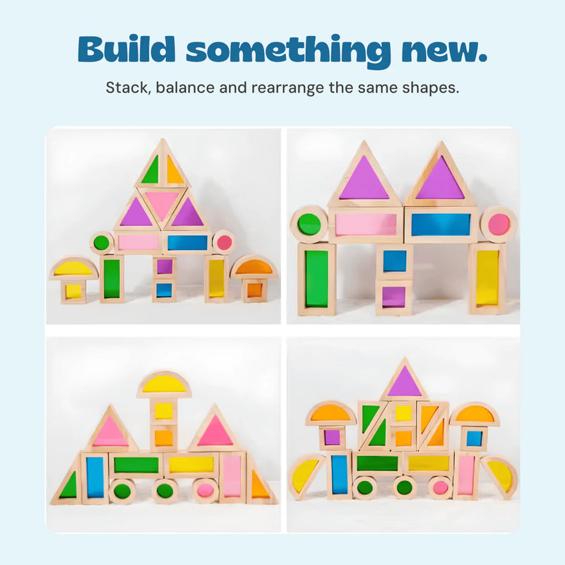 Four different structures made by arranging the same rainbow block shapes.