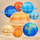 Eight planet paper lanterns hanging against a warm beige backdrop.