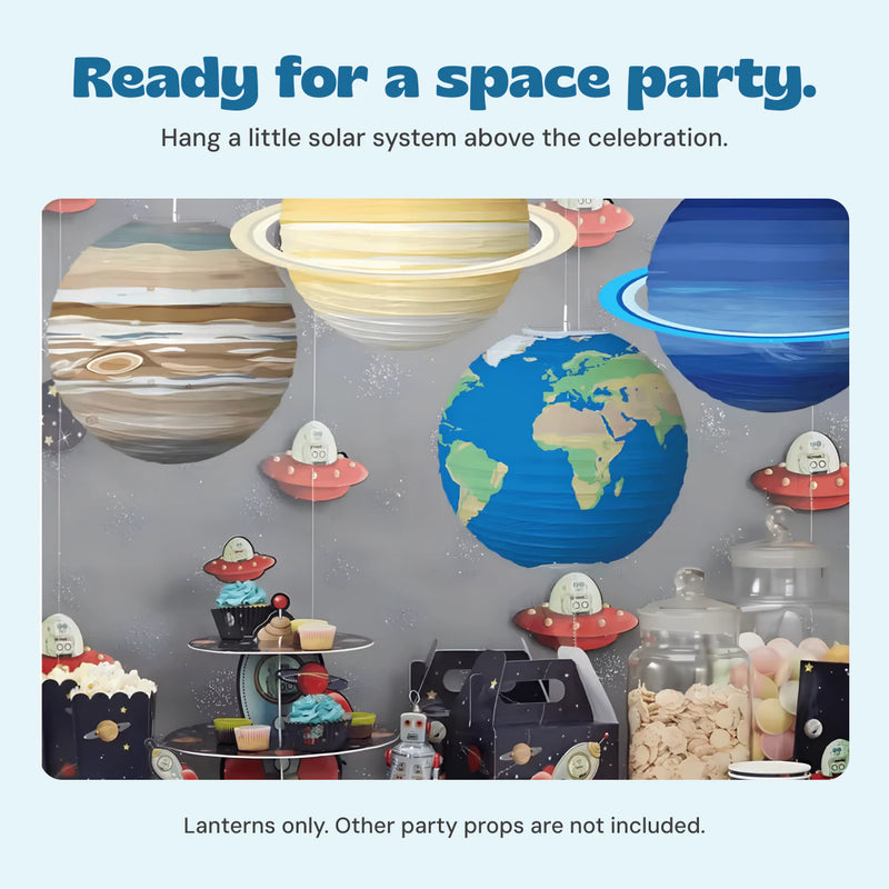 Planet paper lanterns above a space party table; other party props are not included.