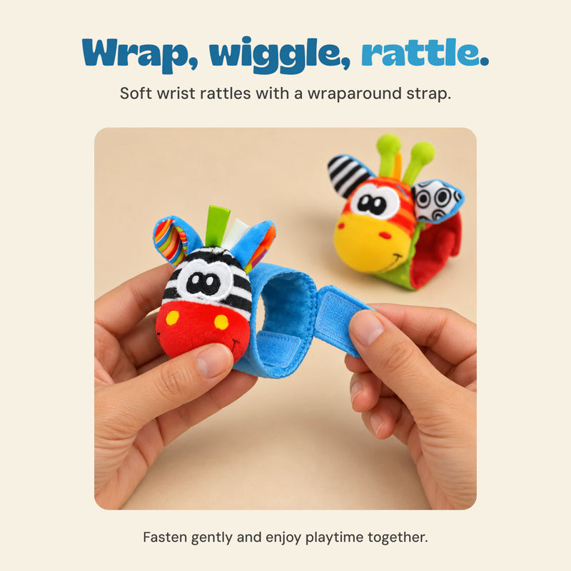 Hands showing the wraparound strap on the blue zebra wrist rattle.