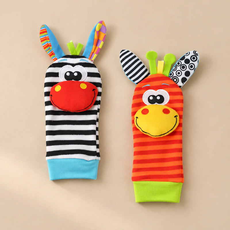 Zebra and giraffe sock rattles with blue and green cuffs.