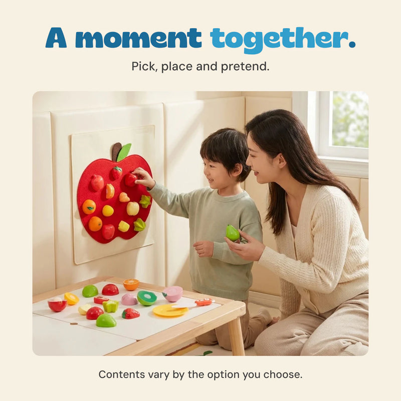 Original photograph of a child placing toy food on the red apple board beside an adult, with pretend food on the table. Contents vary by selected option.