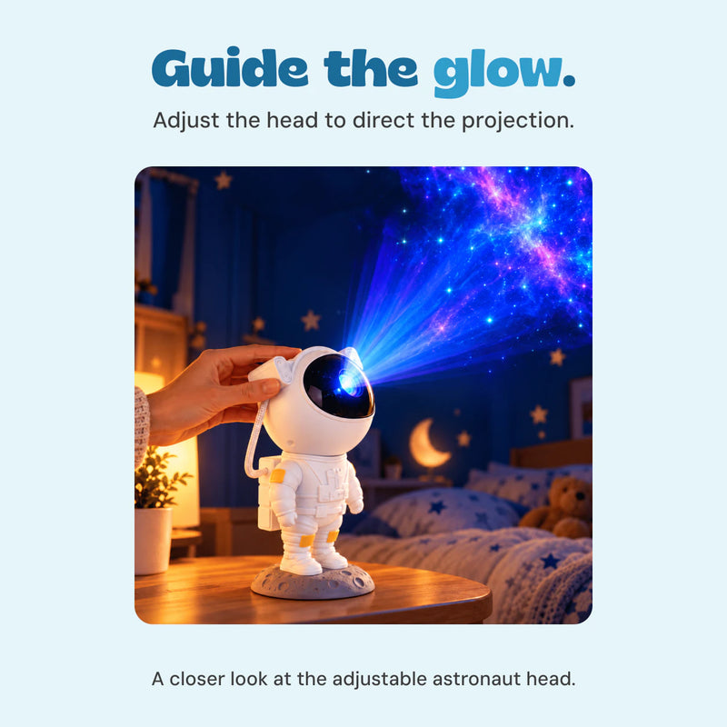 An adult hand adjusts the astronaut projector head while its blue and purple light points toward the ceiling.