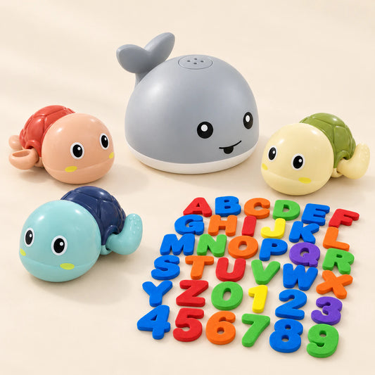 One grey whale sprinkler, three wind-up turtles and the complete foam alphabet and number set on a calm pale beige background.