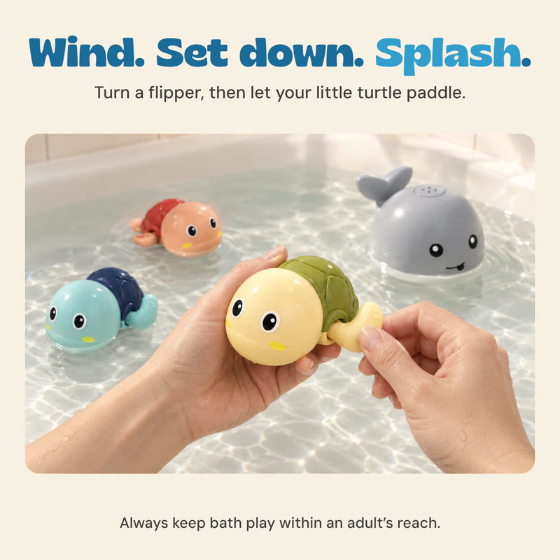 Adult hands turn the flipper of the pale yellow turtle above shallow bath water, with the whale and two other turtles nearby.