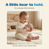 Child holding the bear-shaped teether in the original nursery photograph.