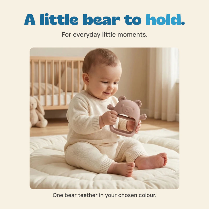Child holding the bear-shaped teether in the original nursery photograph.