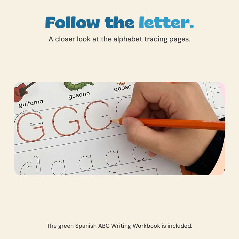Hand holding an orange pencil while tracing a letter G in the Spanish alphabet workbook.