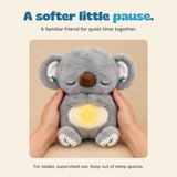 Hands gently holding the Sleepy Koala plush for supervised quiet time together.