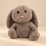Brown Bunny Breathing Buddy plush with long floppy ears and a pink nose.