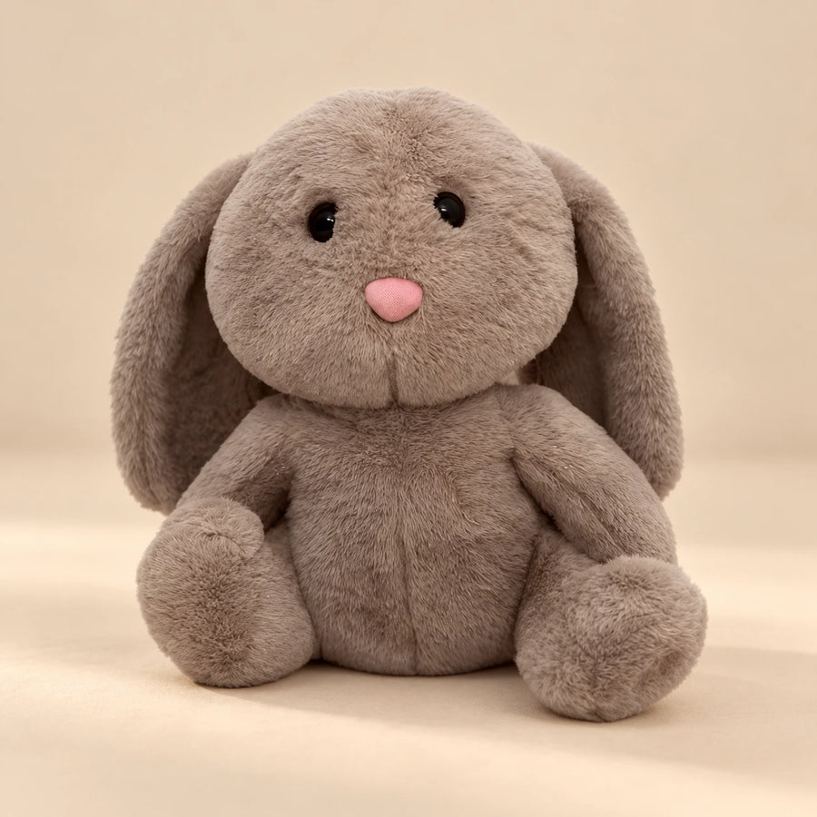 Brown Bunny Breathing Buddy plush with long floppy ears and a pink nose.