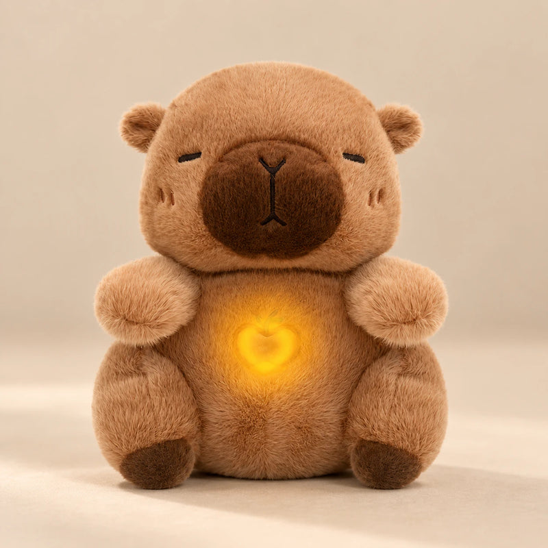 Cocoa Capybara Breathing Buddy plush with a softly glowing apple belly.
