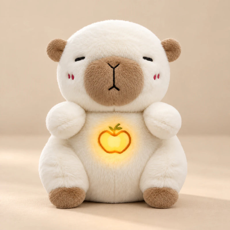 Cream Capybara Breathing Buddy plush with tan ears, muzzle and feet, and an apple belly light.