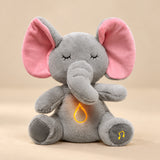 Sleepy Elephant Breathing Buddy plush with pink ears and a warm belly light.