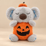 Pumpkin Koala Breathing Buddy with orange pumpkin costume and matching hat.