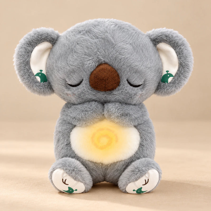 Sleepy Koala Breathing Buddy plush with a softly glowing belly.