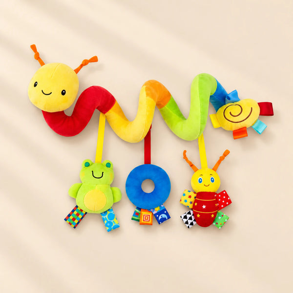 Colourful soft spiral toy with a smiling yellow head, a frog, a blue plush ring and a red bug hanging beneath.