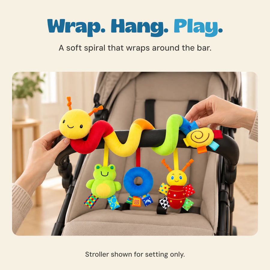 Adult hands position the BusyBuggy soft spiral around the front bar of an empty stroller.