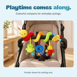 BusyBuggy wrapped around an empty stroller bar in a bright entryway, with all three hanging toys visible.