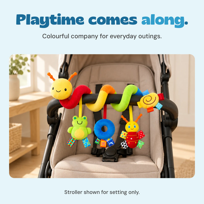 BusyBuggy wrapped around an empty stroller bar in a bright entryway, with all three hanging toys visible.