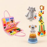 Mermaid Pink busy board with a grey elephant snuggle blanket, blue-neck yellow giraffe rattle and six-ring koala stacking tower on a pale beige background.