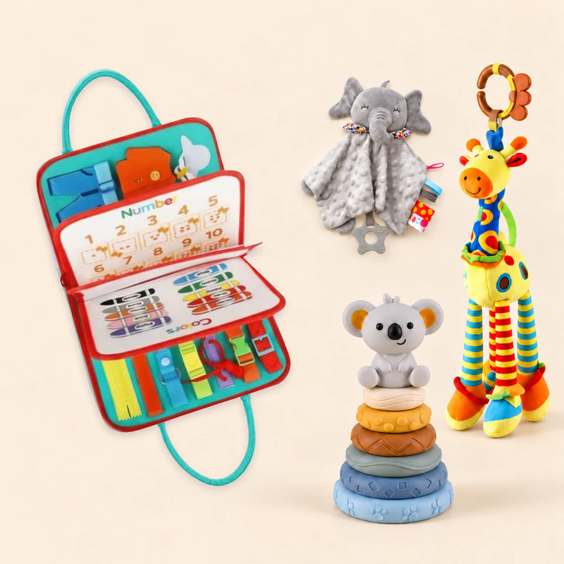 Rocket Green Plus busy board with a grey elephant snuggle blanket, blue-neck yellow giraffe rattle and six-ring koala stacking tower on a pale beige background.