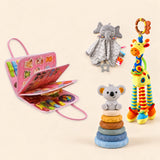 Mermaid Pink Plus busy board with a grey elephant snuggle blanket, blue-neck yellow giraffe rattle and six-ring koala stacking tower on a pale beige background.