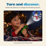 Original photograph of a child turning the green flashlight selector while a snowman picture is projected onto the wall.