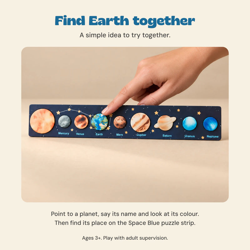 Cropped adult hand points to Earth on the Space Blue solar system puzzle strip, with a simple planet-finding play idea.