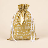 TibaToes Christmas Gift Bag, Large, Christmas Doodles Gold, ribbon closure on a warm beige studio background.