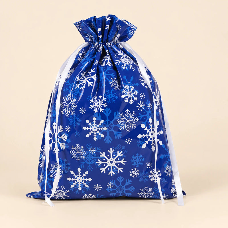 TibaToes Christmas Gift Bag, Large, Snowy Night Blue, ribbon closure on a warm beige studio background.