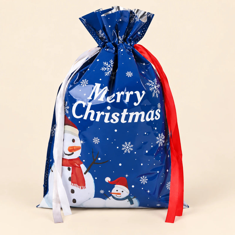 TibaToes Christmas Gift Bag, Medium, Frosty Friends Blue, ribbon closure on a warm beige studio background.