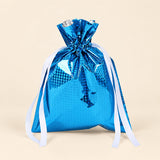 TibaToes Christmas Gift Bag, Small, Winter Sky Blue, ribbon closure on a warm beige studio background.