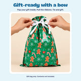 Hands tying the white ribbon on the green gingerbread Christmas gift bag. Place your gift inside, pull the ribbons, then tie a bow.