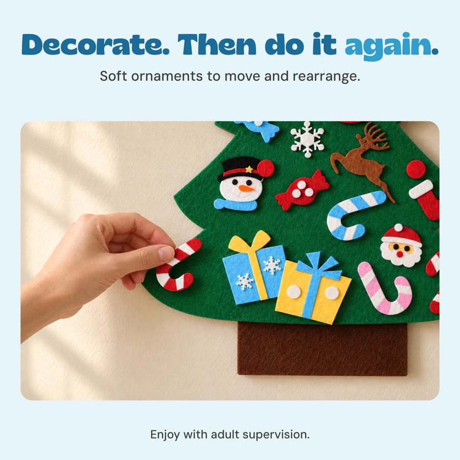 Adult hand repositioning a red-and-white felt candy cane on the green felt Christmas tree.