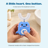 Hands holding the blue EasyBrush with a thumb on its heart-shaped control button.