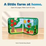 Farm Friends Busy Board open to its apple tree, tomato vine and carrot pages in a calm home setting.