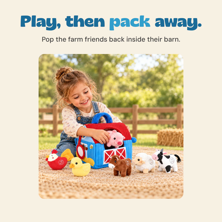 A child places the pink soft pig into the blue barn bag, with the other farm animal toys on the picnic mat.