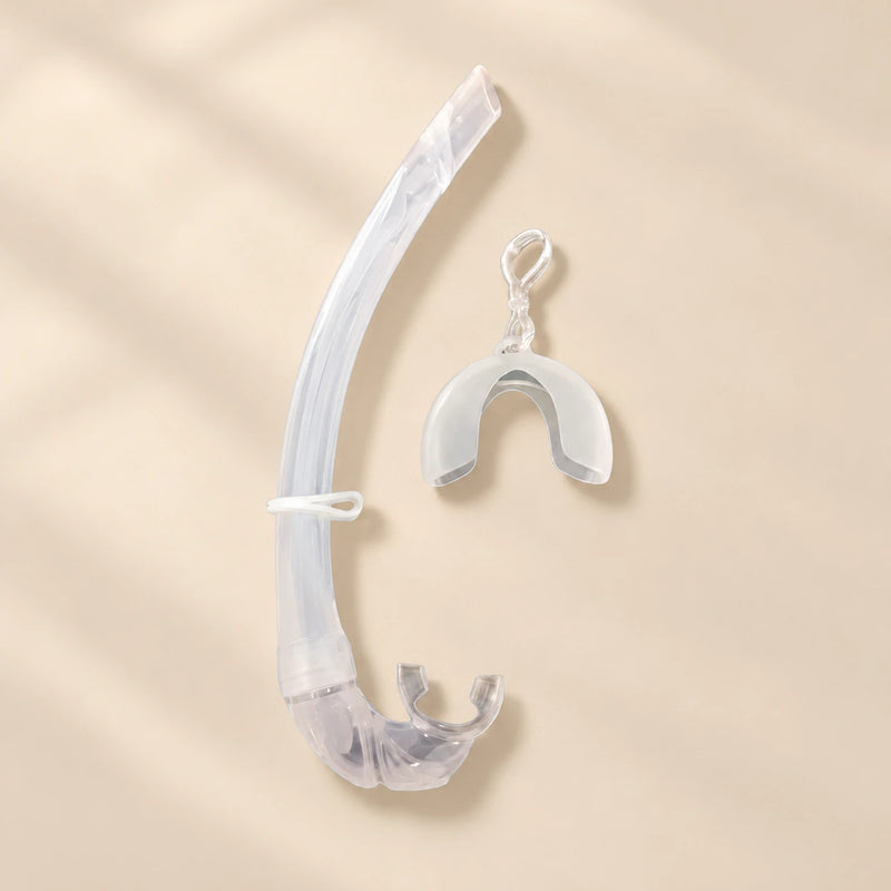 TibaToes foldable snorkel in Clear, with its curved silicone tube, mouthpiece, mask keeper and matching storage cover.